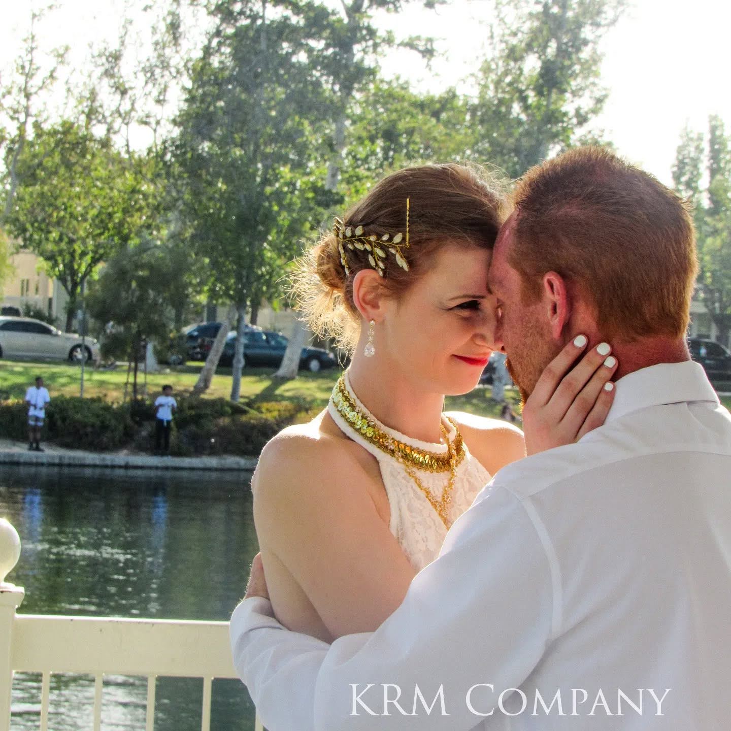 Couple sharing a quiet moment by the water in warm afternoon light